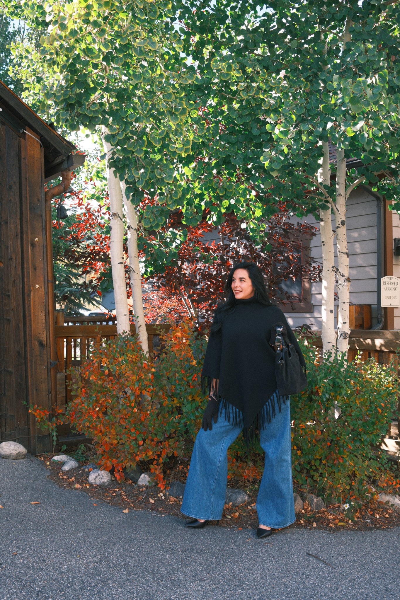 Knit poncho with fringes