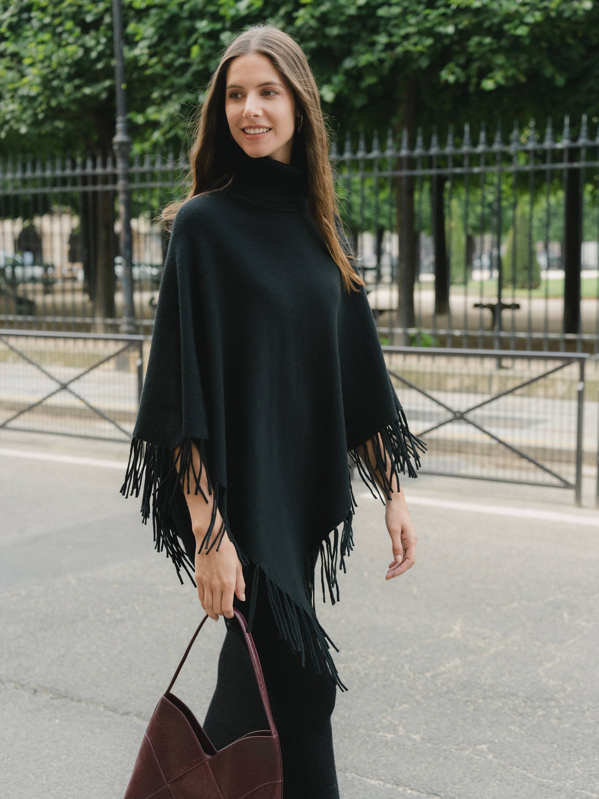 Knit poncho with fringes